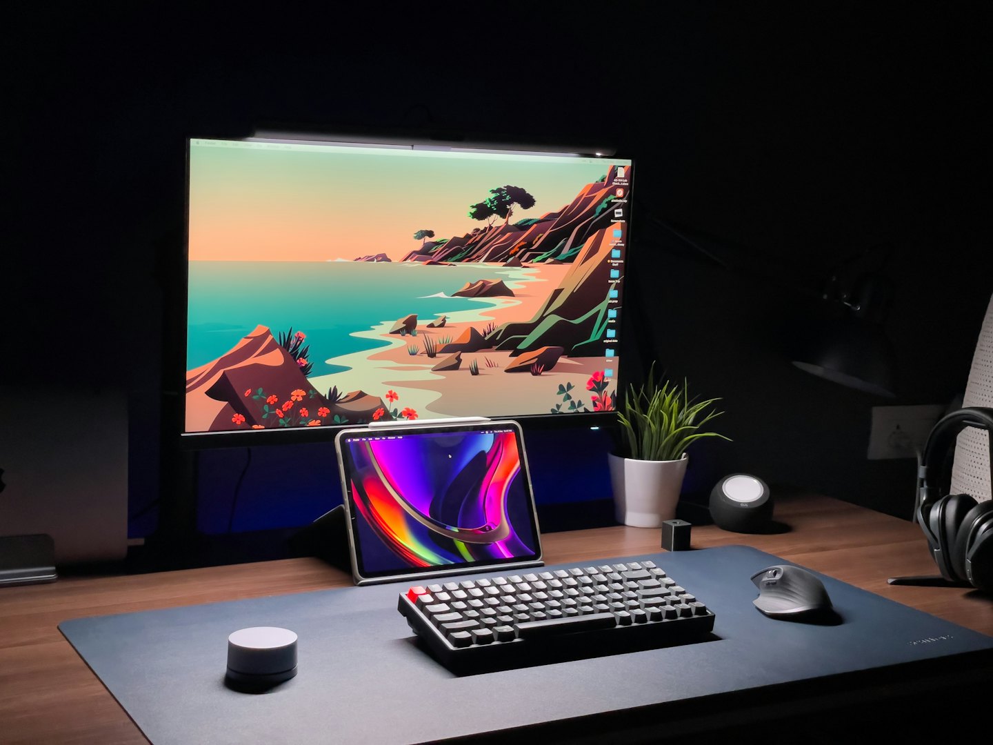 Mechanical keyboard and a monitor showing a beach illustration