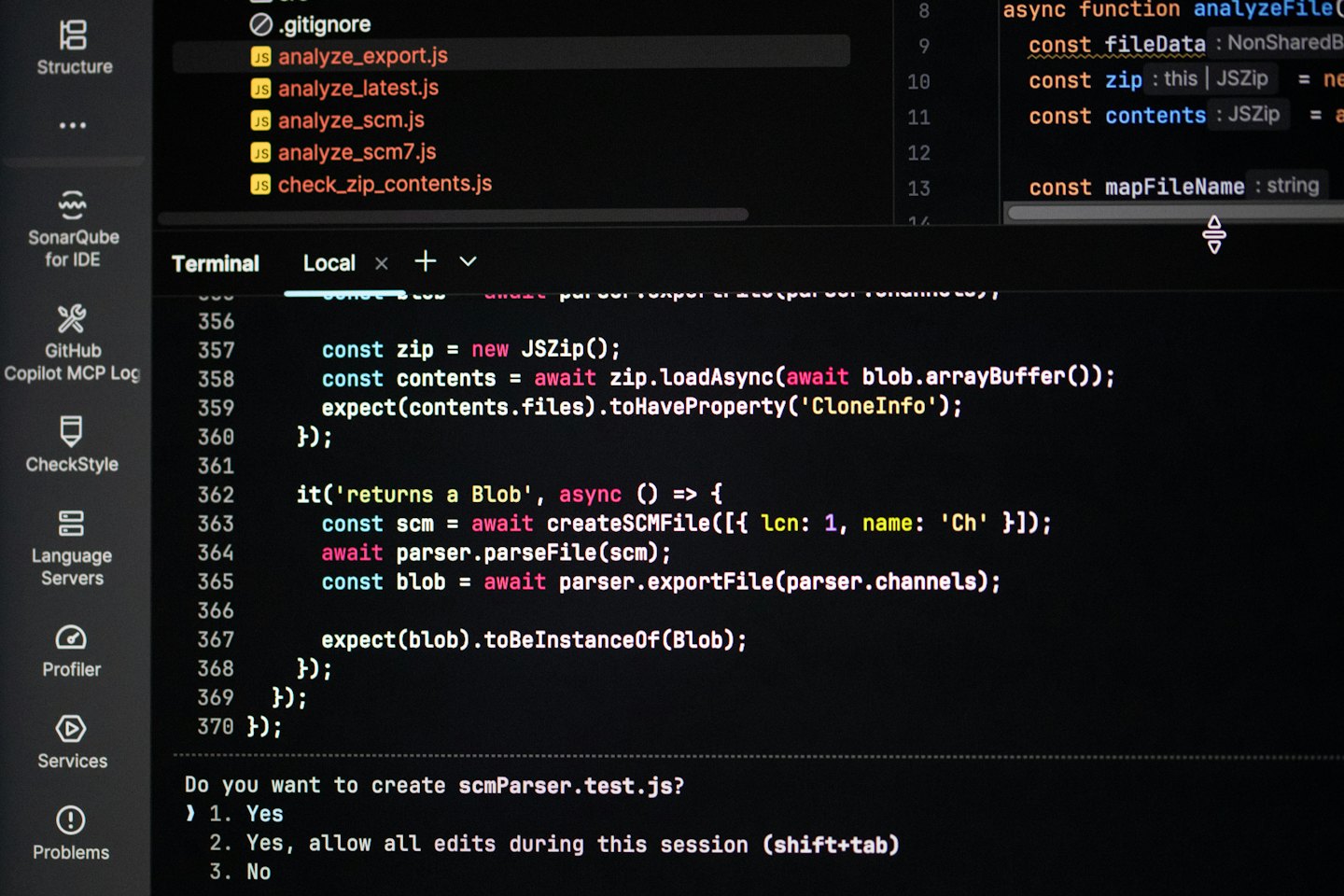 Editor with a JavaScript test file open above the terminal