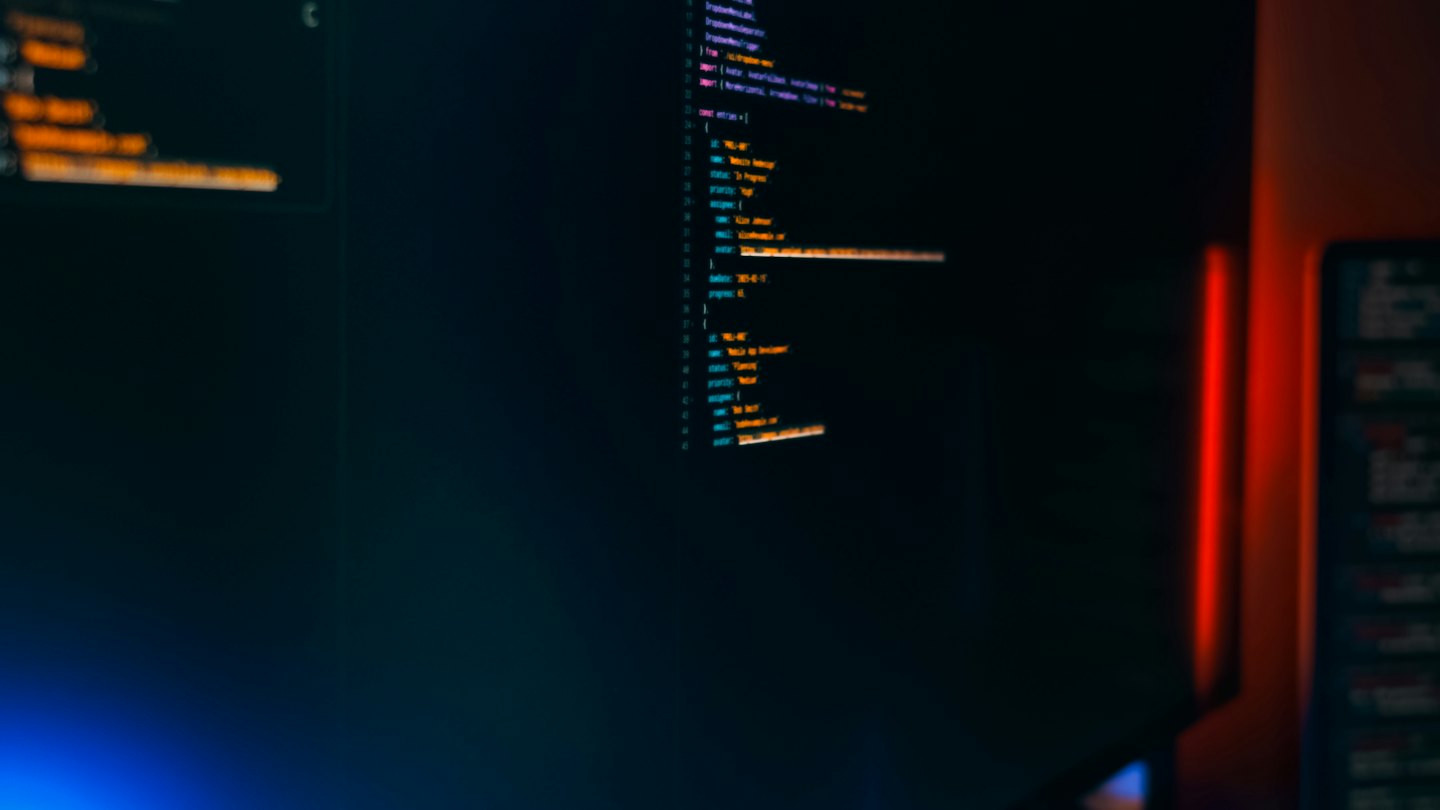 Syntax-highlighted code on a dark screen with a red edge light